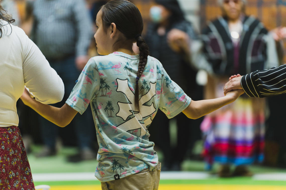 A young member of the audience joins the Celebration Circle.